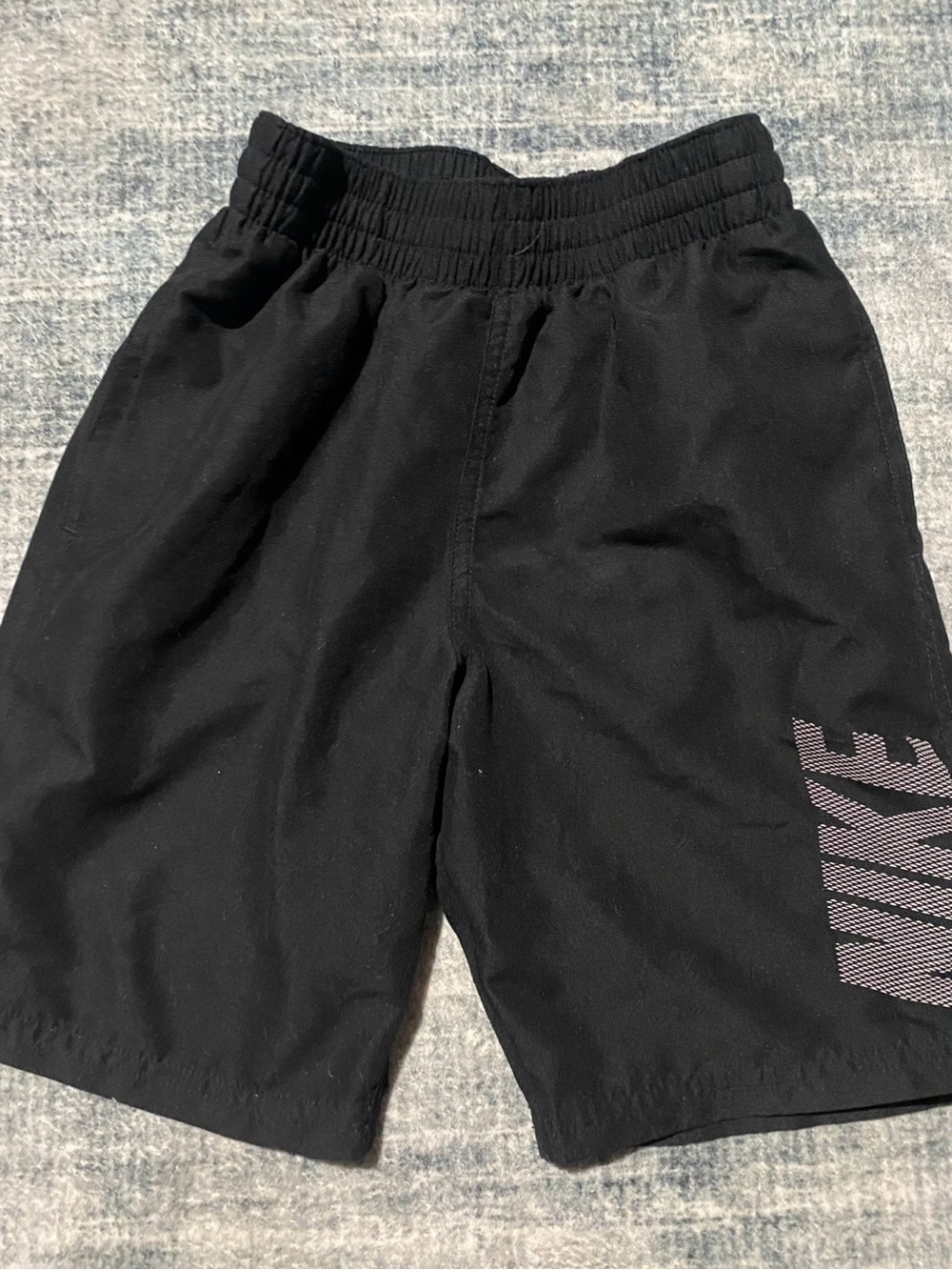 Nike Kids black swim trunks size small